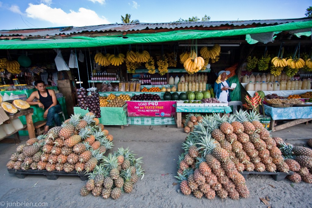 Vibrant outdoor market with fresh produce stalls