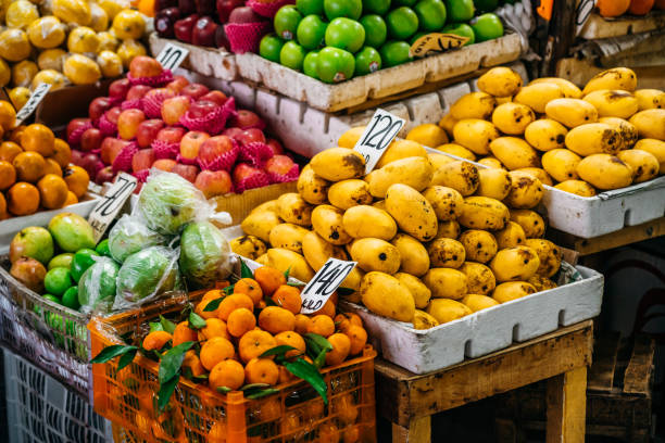 Fruit stand filled with bananas and tropical produce