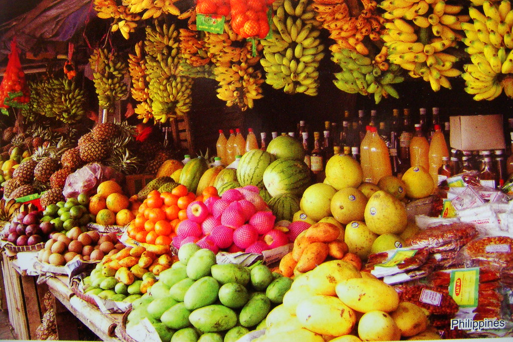Close-up of assorted fruits with pricing